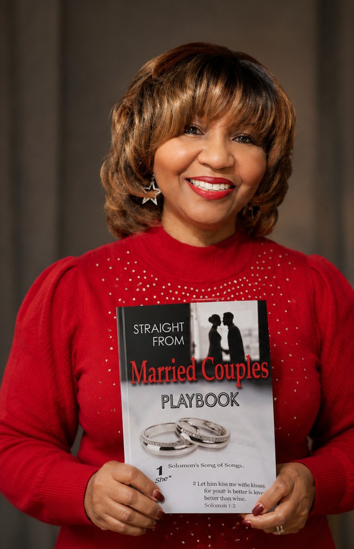 Author Wilma Brumfield-Lofton holding Straight From Married Couples Playbook